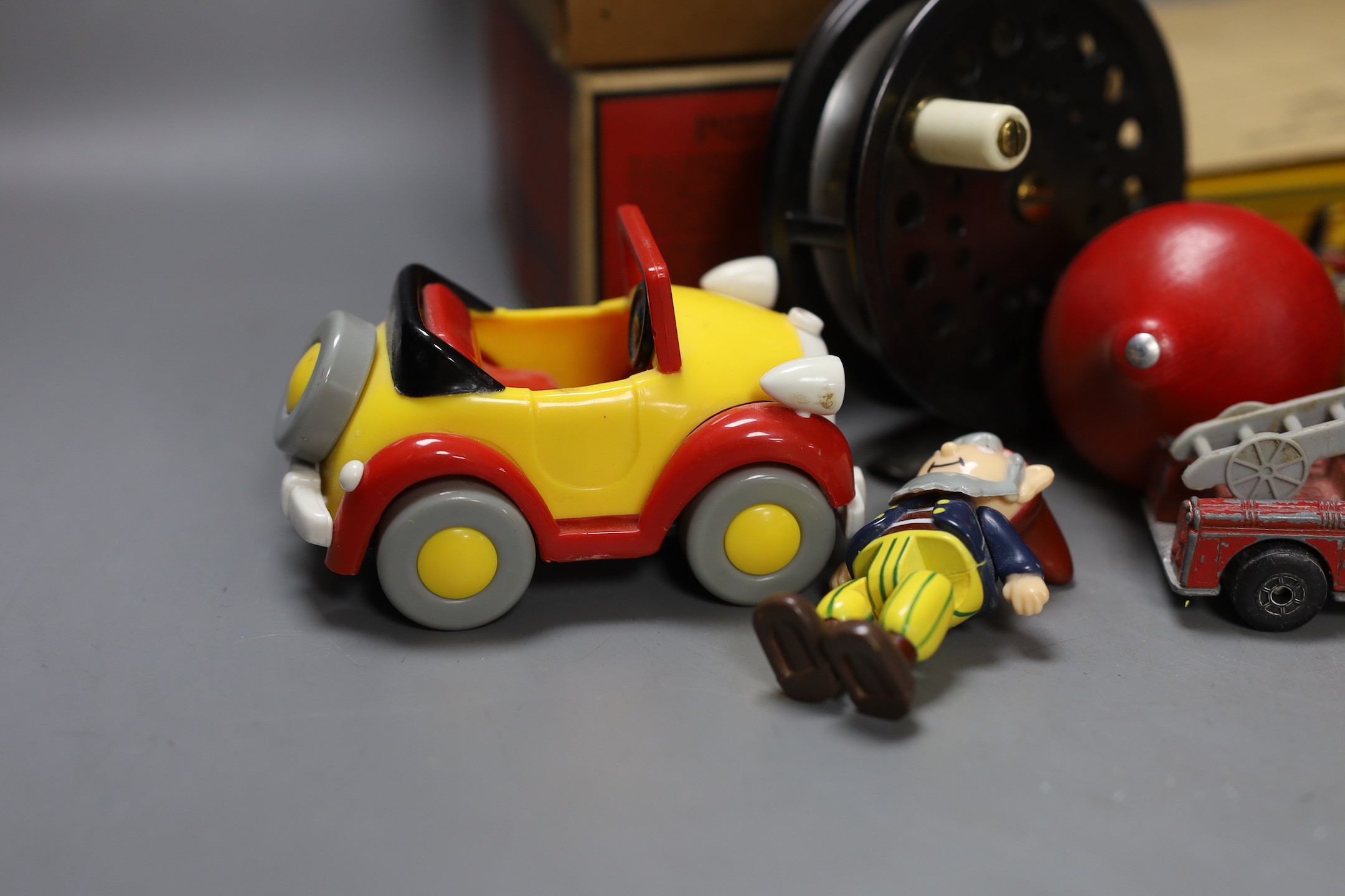 Three fishing reels, flies, lines etc., and a collection of Noddy and Mickey Mouse toys